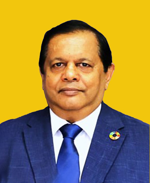 Man in blue suit with SDG pin on yellow background.