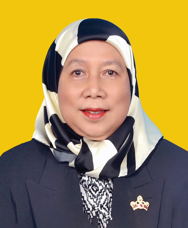 Smiling woman in black-white hijab and dark blazer on yellow background, professional.